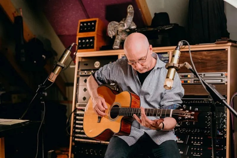 Paul Reed Smith plays an acoustic PRS guitar