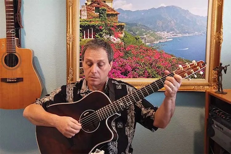 Peppino D'Agostino demonstrates musical examples in alternate tunings on acoustic guitar