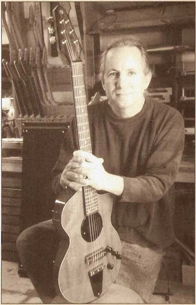 Photo of Rick Turner with guitar from the book Making The Turner Guitar.