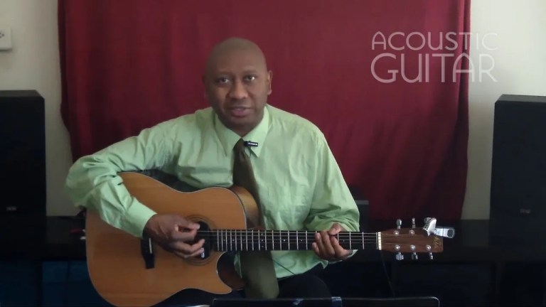 Ron Jackson with a cutaway acoustic guitar