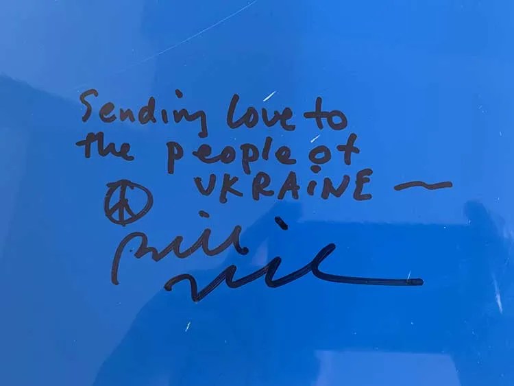 Autographs and messages adorn Linda Manzer's Sunflower Guitar for Ukraine