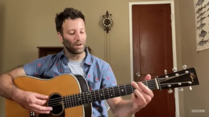 Alan Barnosky demonstrating flatpicking on acoustic guitar