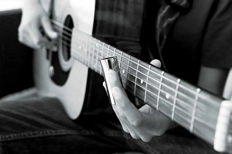 Acoustic guitar played with a slide