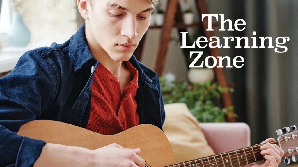 man playing acoustic guitar, the learning zone