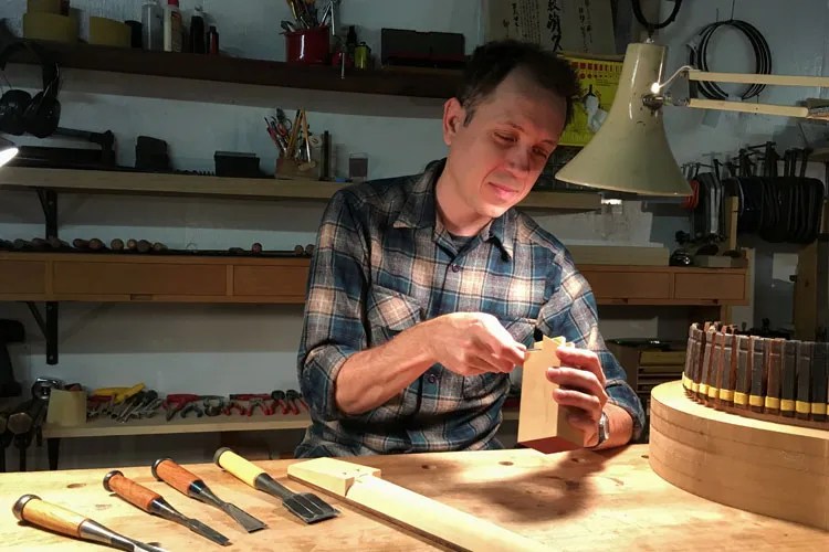 Luthier Tim Frick building an archtop guitar in his workshop