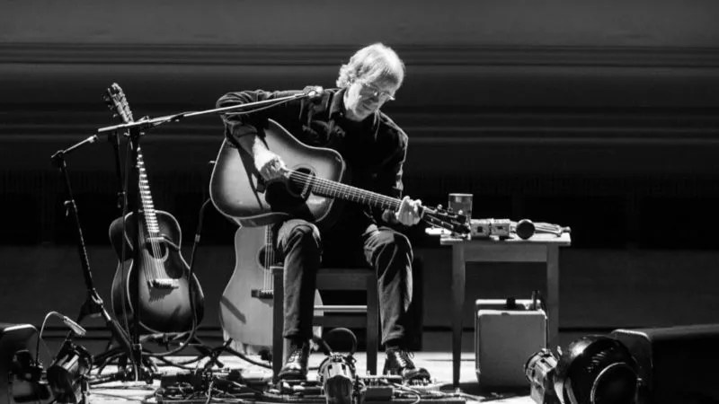 trey anastasio with acoustic guitar onstage