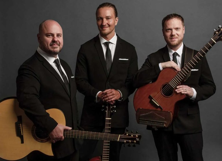 Tripliciti—(left to right) Andy McKee, Calum Graham, and Trevor Gordon Hall—holding acoustic guitars. Photo by Pat Johnson