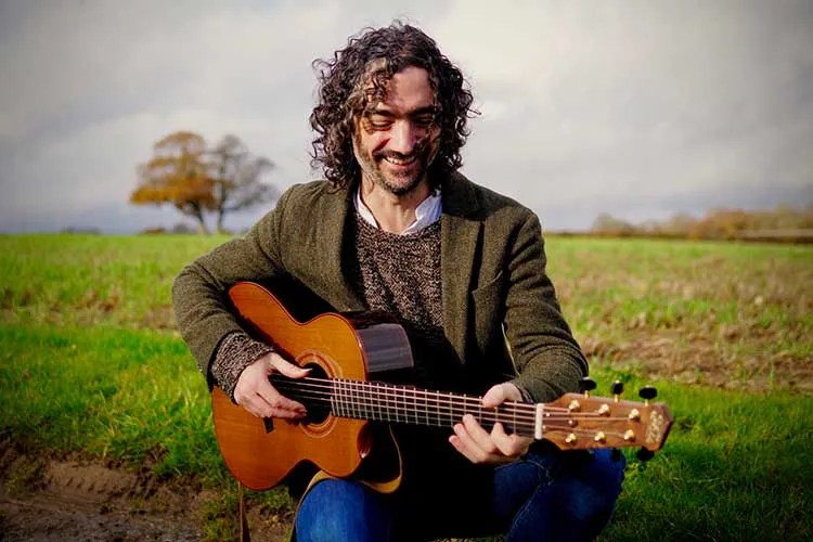 Tristan Seume pictured with a guitar