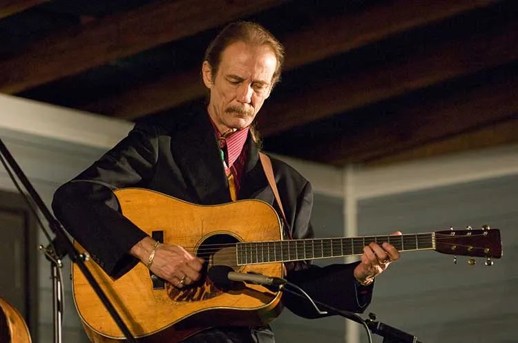 Tony Rice playing acoustic guitar