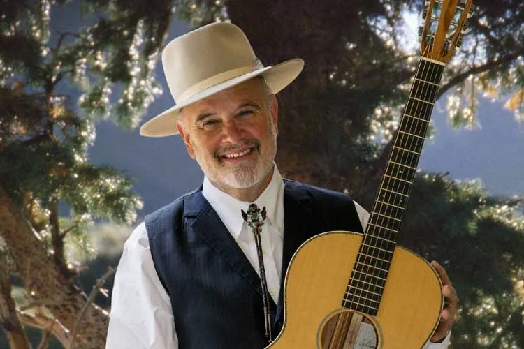 Artist William Matthews, who hand painted the Martin 2016 LE Cowboy acoustic guitar