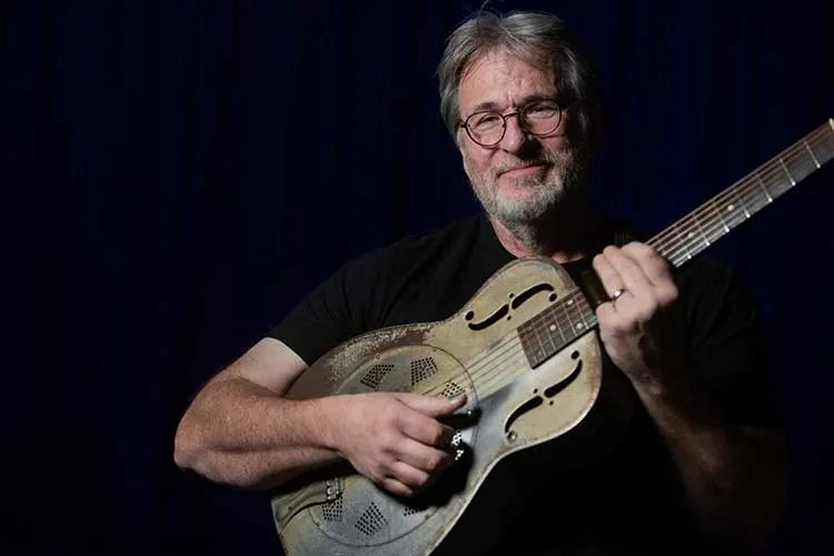 William Lee Ellis playing a resonator guitar. Photo by Jerry Swope