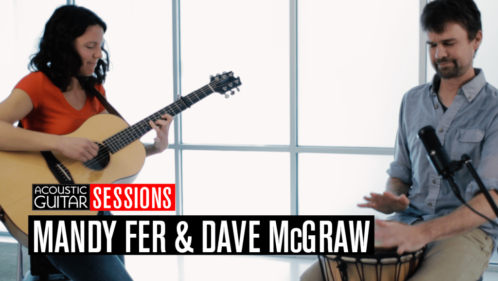 Mandy Fer and Dave McGraw perform with their guitars.