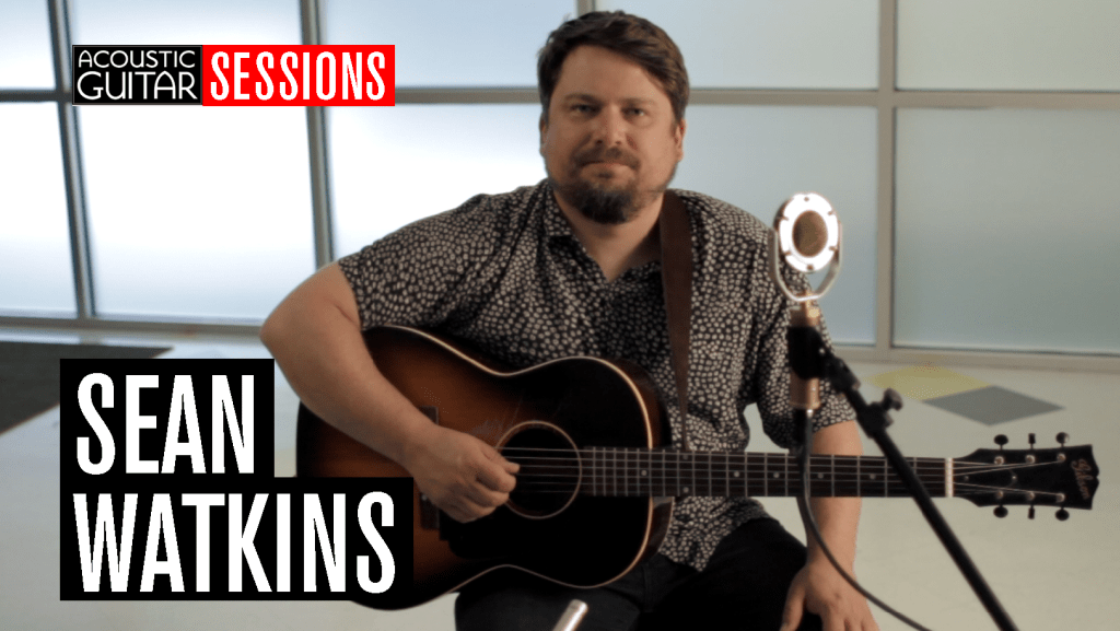 Sean Watkins poses with his guitar