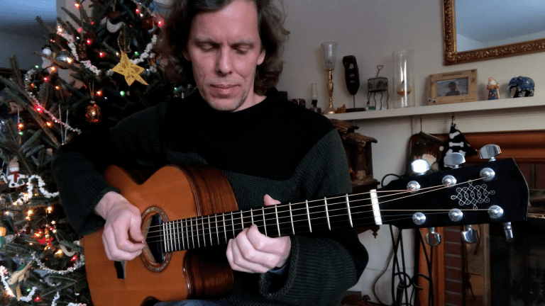 Guitar player Jeffrey Pepper Rodgers playing Silent Night